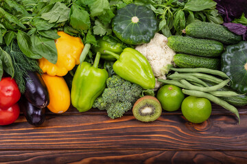 Variety of raw vegetables. Fresh food. Healthy fresh colored fruits and vegetables background. Space for text. Dietary and balanced vegetarian eating products. Assortment of fresh organic vegetables.