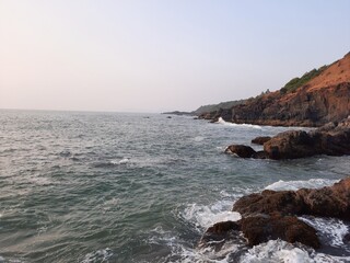 Obraz premium coast of the Arabian sea in goa, Xandrem Beach in goa, tropical sea coast.