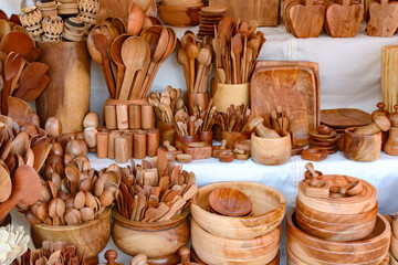 Kitchen utensils made of wood at a street market in Mexico. Mexican handicrafts.