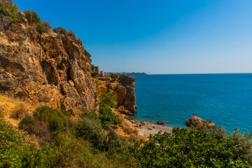 Fototapeta na wymiar ANTALYA, TURKEY: Top view from the cliff on the city of Antalya and the Mediterranean Sea.