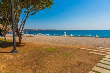 ANTALYA, TURKEY: Konyaalti beach and the Mediterranean sea in sunny summer in Antalya.