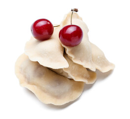 Raw cherry dumplings on white background