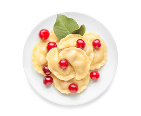 Plate with tasty cherry dumplings on white background