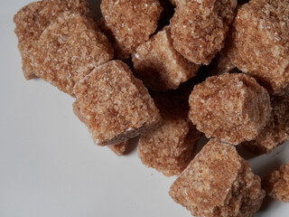 brown sugar cubes isolated on a white background