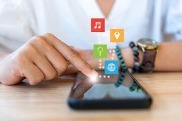 Entertainment icons screen on woman hand using smartphone for relax.
