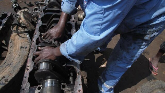 24th may 2021, Lagos Nigeria: Africa local Mechanic Is Checking and repairing the engine of cars and truck at the mechanic workshop.
