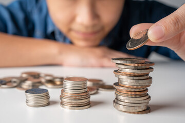 People hand putting money coin stack growing, Saving money concept.