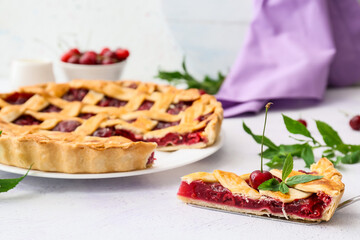 Spatula with piece of tasty cherry pie on light background, closeup