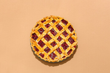 Tasty cherry pie on color background