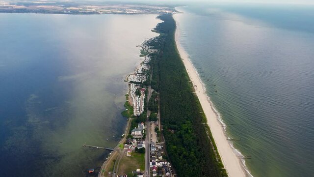 Fly over Hel Peninsula on Baltic sea. Aerial view in Chalupy in the morning.