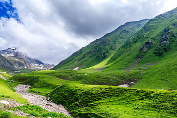 Fototapeta na wymiar Nalati grassland with beautiful mountain scenery in Xinjiang,China.