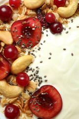 Obraz na płótnie Canvas Tasty yogurt with different ingredients, close up