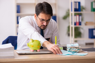 Young male bookkeeper in pension concept