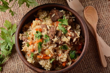 Fried and stewed beef meat with rice. Uzbek cuisine  pilaf (plov)