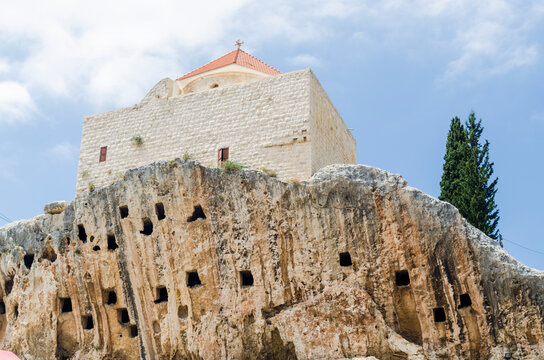 St. John Al-Sheer Church sitting on a cliff above man-made crypts, Amioun, Lebanon