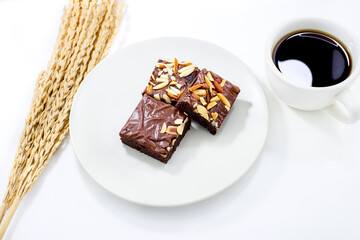 Brownie in dish on white background.