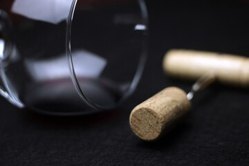 closeup detail of glass of red wine and pulls cork. Sale and distribution of wines. wine tasting