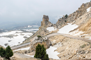 Mountain road in Lebanon with rock formations and snow in Laqlouq near Sayidat al Qarn church