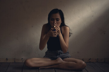 Young woman smoking cigarette, cannabis, marijuana.
