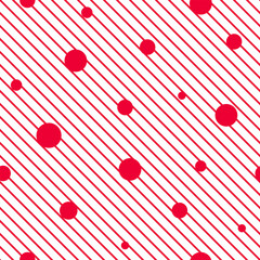 Seamless pattern with red circles and dots on diagonal stripy background.