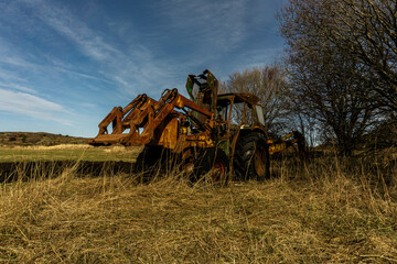 old rusty tractor in a field