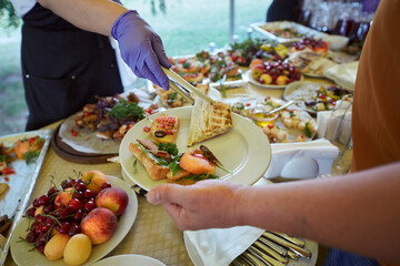 Served table with delicious dishes for banquets, parties, forums, conferences. Catering food.