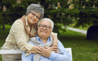 Happy senior couple enjoying life in retirement. Portrait of cheerful old grandparents against...