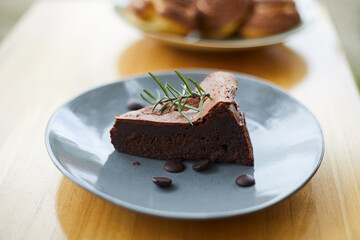 slice of tasty homemade chocolate cake on table.