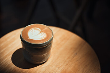 Selective focus cup of hot latte art coffee