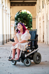 woman with disabilities in a wheelchair using smarphone