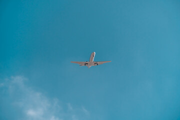 Naklejka premium Business jet in blue sky. Travel, air transportation concept