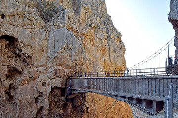 Very dangerous suspension bridge between mountains of the tourist place of Caminito del Rey in the Sierra de Ardales, Malaga, Andalusia, Spain