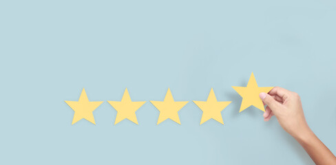Hand of touching rise on increasing five stars. Increase rating evaluation