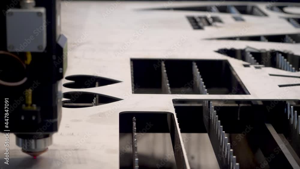 Poster robotic machine with laser for metal cutting. hdr. close-up of industrial laser cuts patterns on met