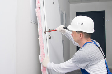 after breaking the lock, the dismantled door is tried to open with a special tool for hacking