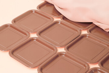Stylish chocolate creme brulee banner. Plastic plate and textile background