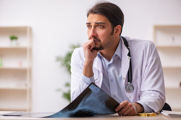 Young male doctor radiologist working in the clinic