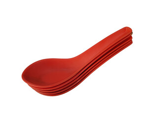 a stack of red coloured soup plastic spoon on white background
