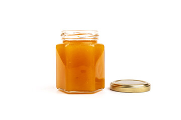 Glass jar full of sweet honey isolated on white background