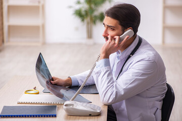 Young male doctor radiologist working in the clinic
