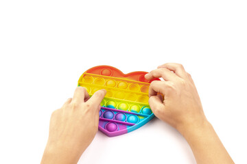 Silicon modern Toy anti-stress popit will be a heart on a white background. toy pop it or simple dimple.