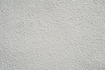 Stucco texture of cement wall, White painted and surface rough of concrete wallpaper background