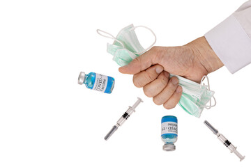 Glass vials labelled covid-19 vaccine and a glass syringe floating around a hand of a person.