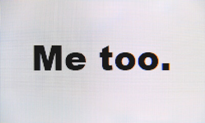 The words Me Too, typed on a computer monitor. Macro detail shot, with the LED dots detail.
