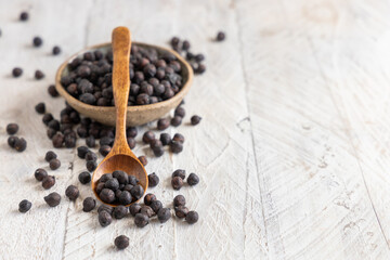 Bowl of black chickpea with spoon closeup
