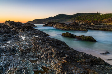 Sunrise seascape and a rocky beach