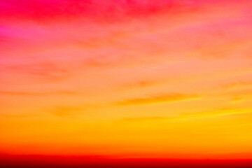 Fototapeta premium Phantasmagorical vivid colorful cloudscape at sunset time. Abstract nature background.