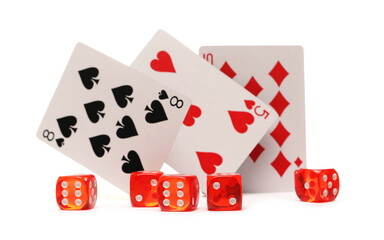 Playing cards and dice pile for poker and gambling, isolated on white background