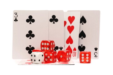 Playing cards and dice pile for poker and gambling, isolated on white background