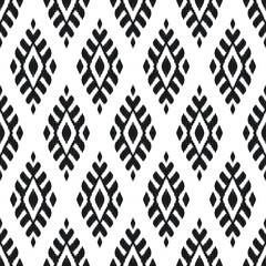 Ikat seamless pattern for home decor ideas, textile, wallpaper, card or wrapping paper. Ethnic, Indian, Aztec, boho fashion style. Tribal vector background. Black and white graphic design.
